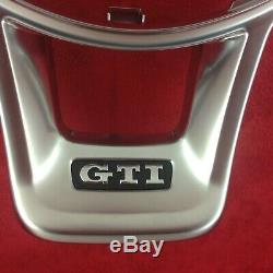 Genuine OEM VW Golf GTi MK7 flat bottom steering wheel chrome trim bezel. 9B
